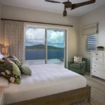 Ocean view out of a chic guest bedroom