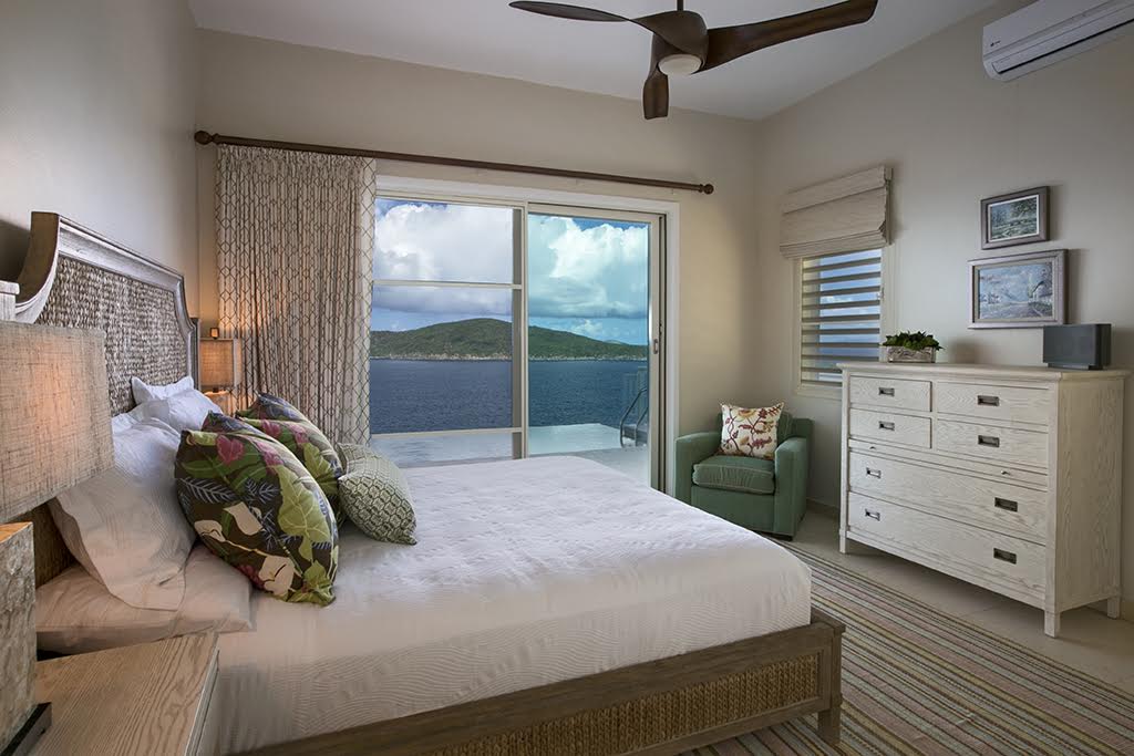 Ocean view out of a chic guest bedroom