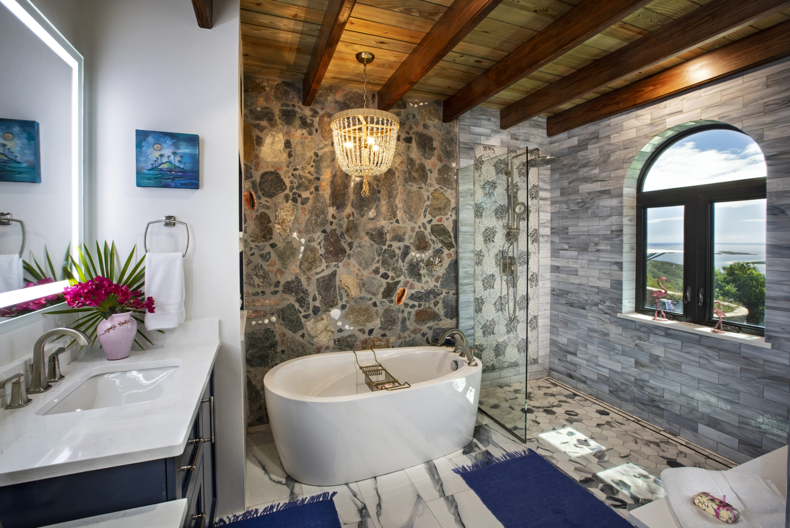 Master bath with stained glass and stone walls.