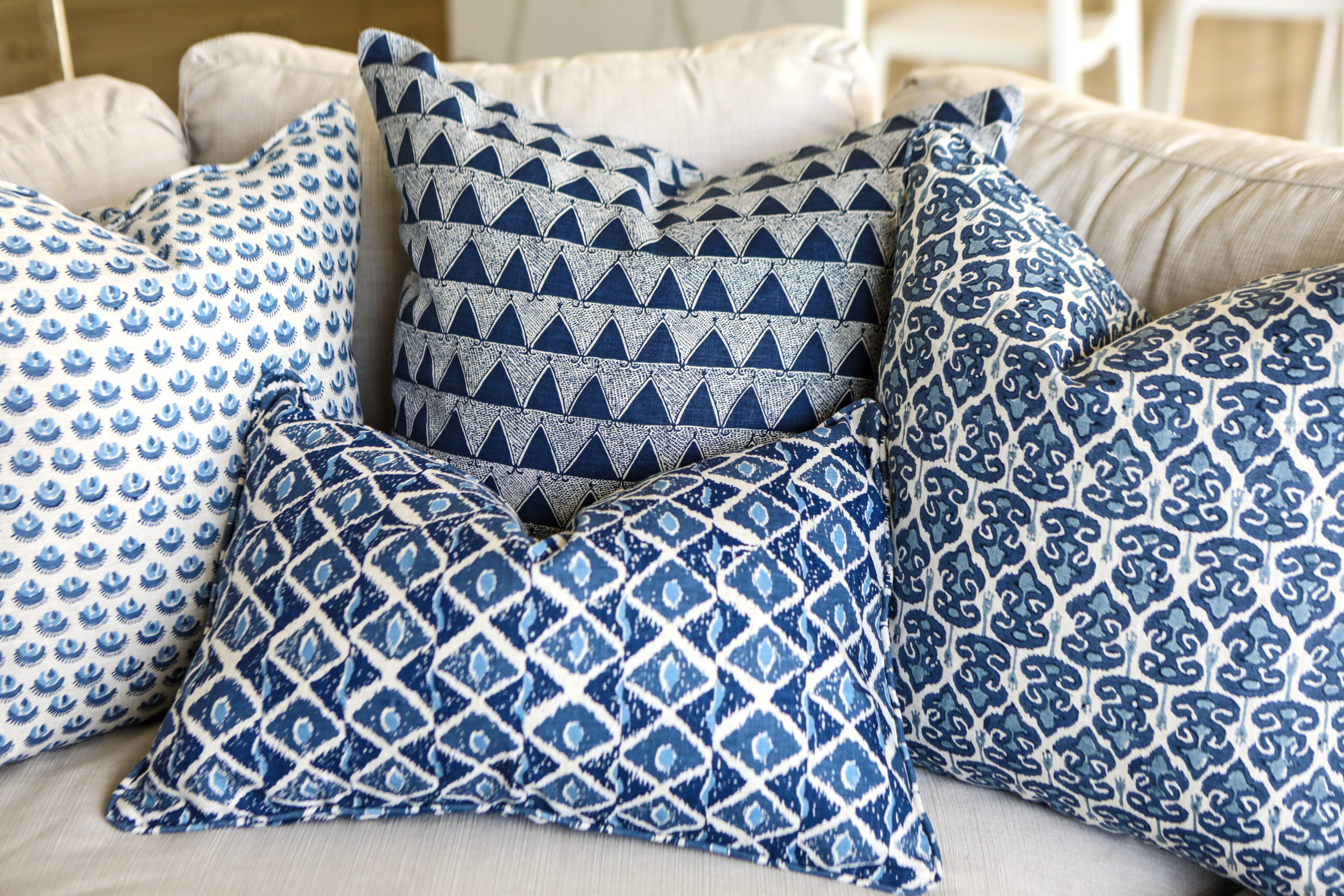 blue batik accent pillows complementing a comfortable white sofa