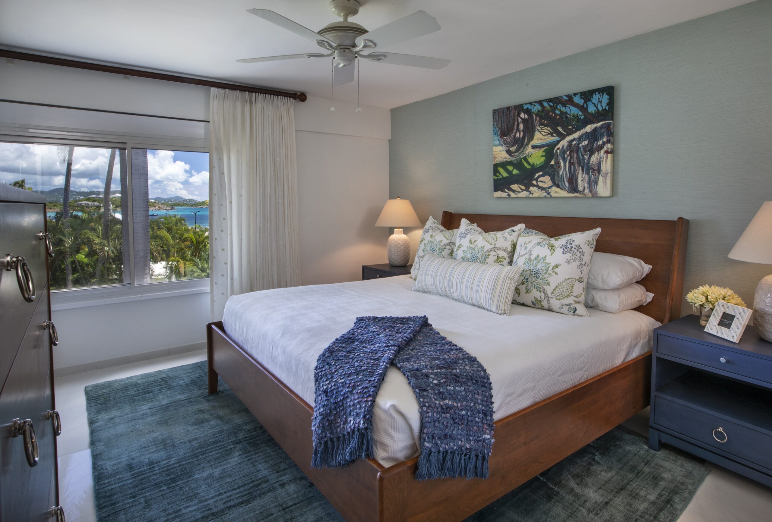 island bedroom with grasscloth wallpaper