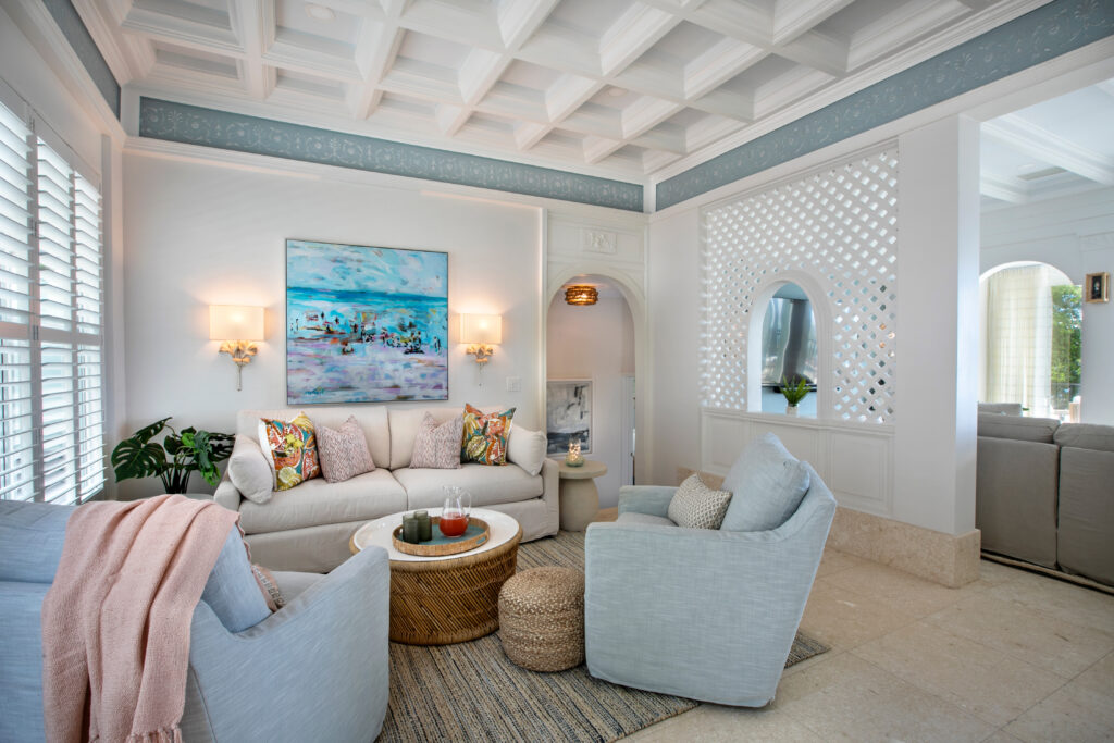 Gorgeous lounge area with art, sconces, and side tables