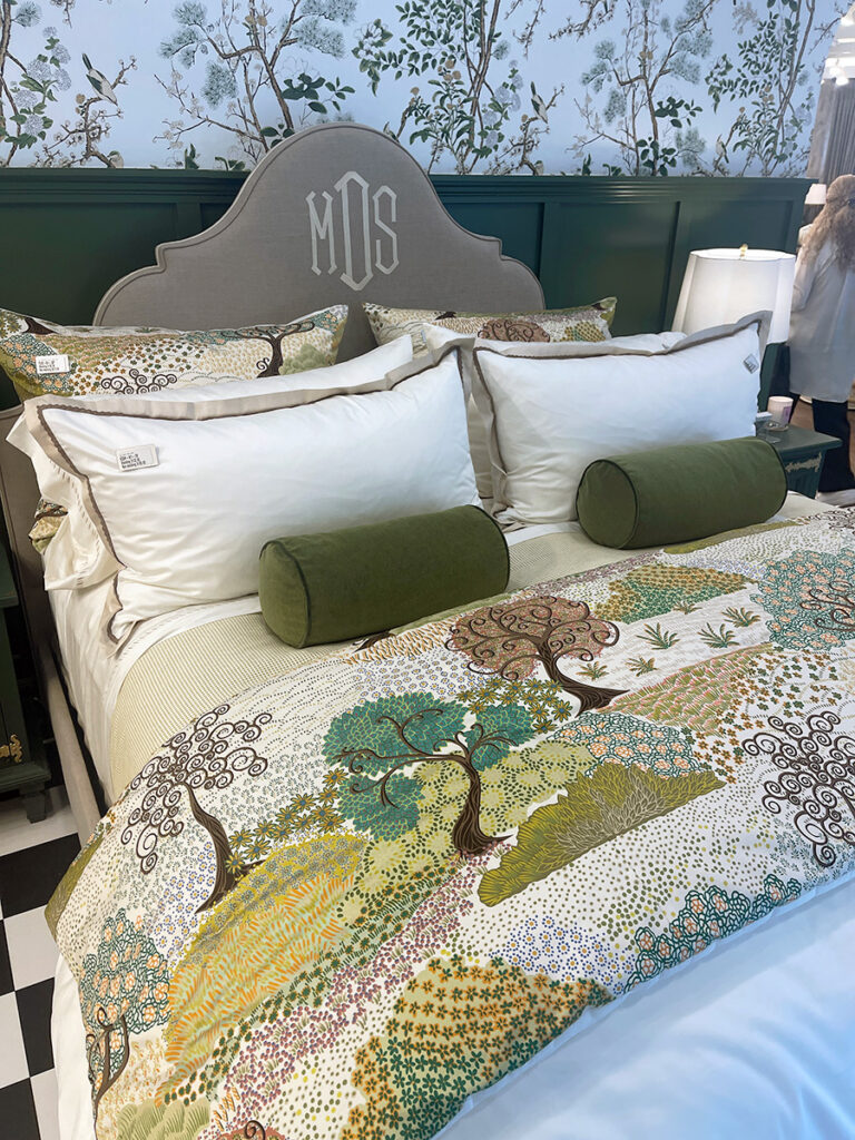 headboard with monogram embroidered. Tree motif quilt. at high point 2026