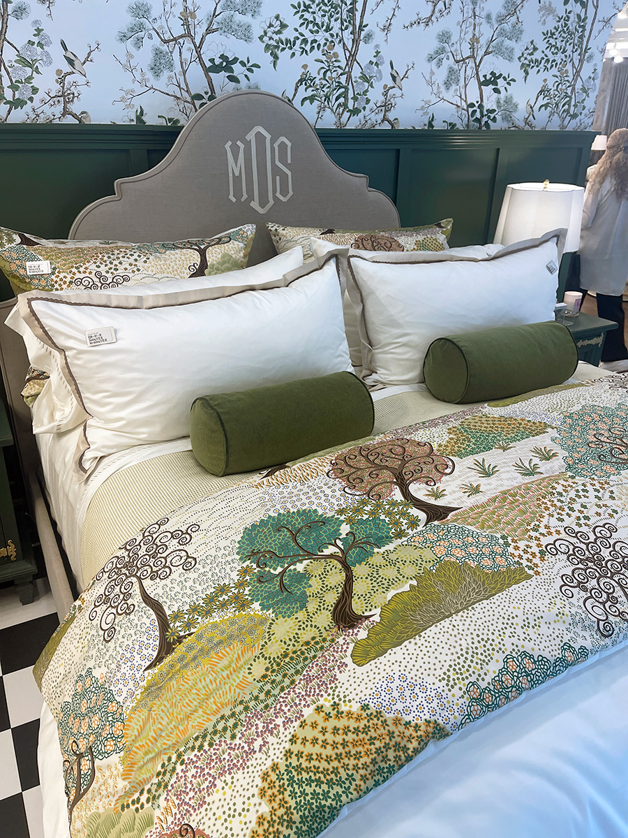 headboard with monogram embroidered. Tree motif quilt. at high point 2026