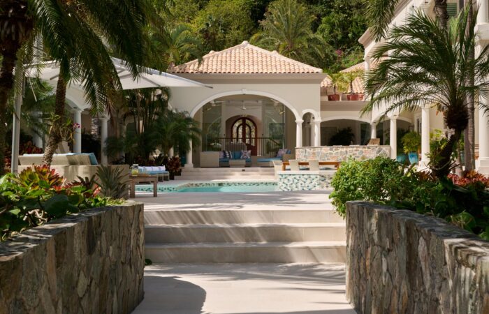 Peter Bay home remodel exterior pool and covered outdoor patio spaces relaxing island design style